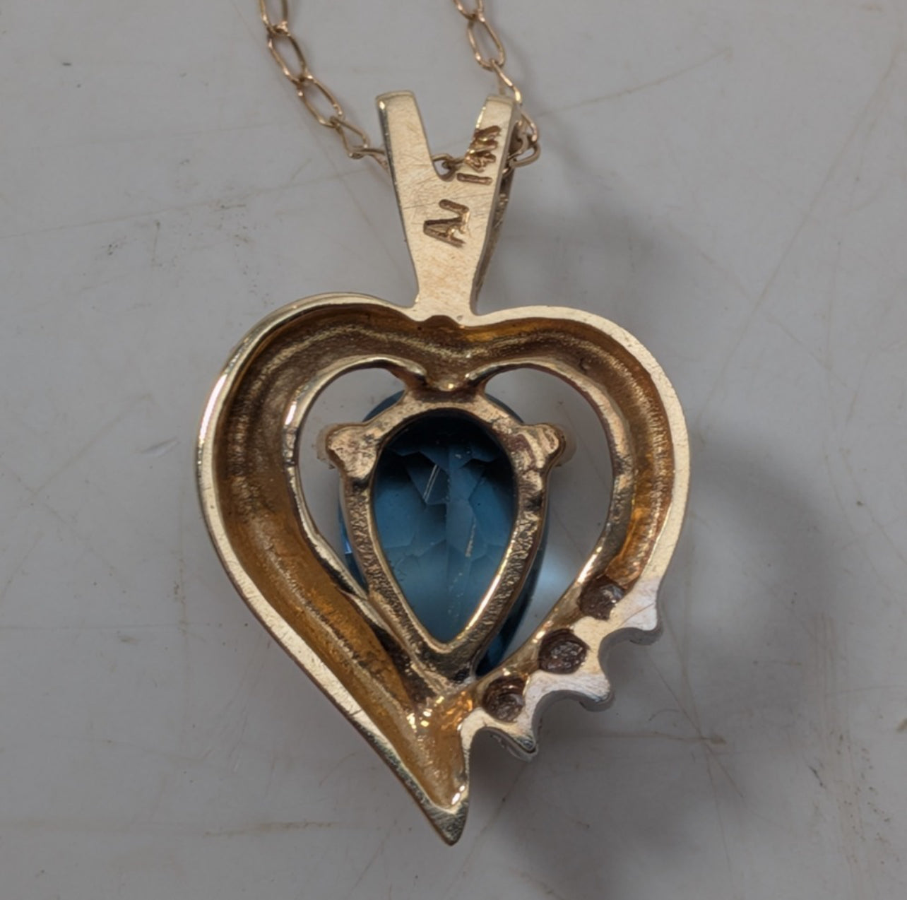 14K Yellow Gold Heart Necklace w/ (1) Blue Stone & (3) Clear Stone Accents